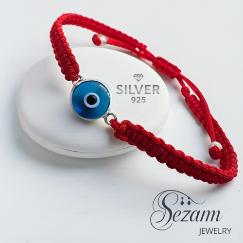 гривна с червен конец  и сребърно синьо око против уроки  